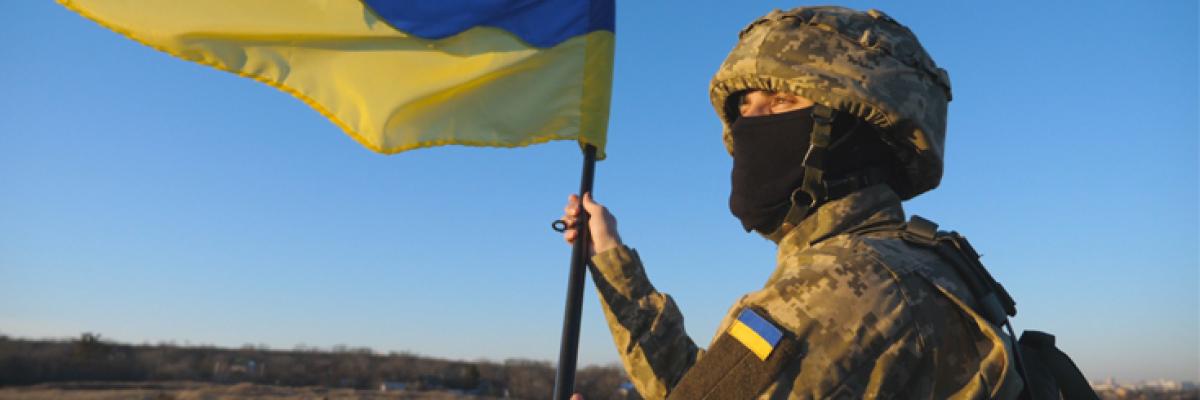 A soldier holding a flag.